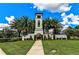 Community entrance features a tower, walkway, lush landscaping, and 'Del Tierra' signage at 452 Tierra Verde Way, Bradenton, FL 34212