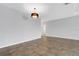 Spacious living room features tiled floors and modern light fixture at 452 Tierra Verde Way, Bradenton, FL 34212