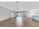 Large open living room with tile flooring and sliding doors to the lanai at 452 Tierra Verde Way, Bradenton, FL 34212