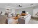 Open-concept living room with tile floors, ceiling fan, recessed lights, and neutral color palette at 452 Tierra Verde Way, Bradenton, FL 34212