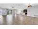 Open-concept living area with sliding doors leading to a lanai and a kitchen area at 452 Tierra Verde Way, Bradenton, FL 34212