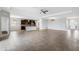 Open layout featuring natural light, a large living area, and a kitchen with dark cabinets at 452 Tierra Verde Way, Bradenton, FL 34212