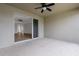 View from the covered patio through sliding glass doors into the open-concept living space at 452 Tierra Verde Way, Bradenton, FL 34212