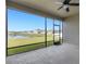 Covered and screened patio with picturesque views of the pond and neighborhood at 452 Tierra Verde Way, Bradenton, FL 34212