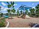 Community playground with slide, climbing wall, and shade structure in a fenced area at 452 Tierra Verde Way, Bradenton, FL 34212