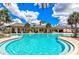 Resort-style pool with lounge chairs and covered area, perfect for relaxation and socializing at 452 Tierra Verde Way, Bradenton, FL 34212