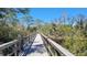 Tranquil community boardwalk winding through trees and lush marshland. Enjoy nature! at 5649 Key Largo Ct, Bradenton, FL 34203