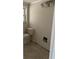 This bathroom features a toilet, decorative window, and tile floors at 618 Jungle Queen Way, Longboat Key, FL 34228