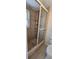 Tiled shower with glass sliding door, storage rack, and neutral tile surround in this home bathroom at 618 Jungle Queen Way, Longboat Key, FL 34228