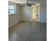 This bedroom has a ceiling fan, and a window that allows for natural light at 618 Jungle Queen Way, Longboat Key, FL 34228