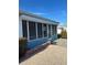 Florida home with screened lanai and beautiful landscaping at 618 Jungle Queen Way, Longboat Key, FL 34228