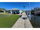 Beautiful home with a well-manicured lawn, and private dock extending into the canal at 618 Jungle Queen Way, Longboat Key, FL 34228