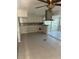 Spacious kitchen shows the start of a remodel with a hood vent, tile floor, and view to the sunroom at 618 Jungle Queen Way, Longboat Key, FL 34228
