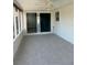 This lanai provides an area for outdoor enjoyment with its tile floor, ceiling fan, and access to outdoors at 618 Jungle Queen Way, Longboat Key, FL 34228