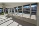 Screened lanai with tile floors and views of the canal at 618 Jungle Queen Way, Longboat Key, FL 34228