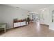 Inviting living room featuring tile floors, modern furnishings, and a bright, open layout at 9008 Allapata Ln, Venice, FL 34293