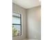 Neutral bedroom with a window and a view of the exterior at 10612 Nicklaus Ct, Englewood, FL 34223