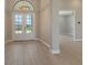 The grand foyer offers tile flooring, recessed lighting and a view through the home out the back at 10612 Nicklaus Ct, Englewood, FL 34223