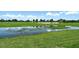 Water view from the golf course offers beautiful scenery and adds a touch of nature to the game at 10612 Nicklaus Ct, Englewood, FL 34223