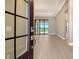 This stunning home is enhanced by tile flooring, recessed lighting, and sliding glass doors to a pool area at 10612 Nicklaus Ct, Englewood, FL 34223
