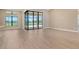 This spacious living room offers tile flooring and sliding glass doors which allow for plenty of natural light at 10612 Nicklaus Ct, Englewood, FL 34223