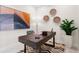 Modern home office design featuring a sleek wood desk, stylish decor, and a neutral color palette at 111 Golden Gate Pt # 401, Sarasota, FL 34236