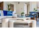 Bright living room with stylish neutral decor, contemporary furniture, and modern open layout at 111 Golden Gate Pt # 401, Sarasota, FL 34236
