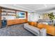 Upscale resident lounge features stylish decor, modern furniture, built-in shelving, and a relaxing atmosphere at 111 Golden Gate Pt # 401, Sarasota, FL 34236