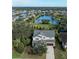 Stunning two-story home with pond view in a tranquil neighborhood, lush landscaping and a private driveway at 12941 Bliss Loop, Bradenton, FL 34211