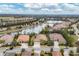 An aerial view highlights the home's desirable location, backing onto a lake, in a beautiful planned community at 16621 Berwick Ter, Lakewood Ranch, FL 34202