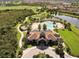 This aerial showcases the community pool with tropical landscaping and water features at 16621 Berwick Ter, Lakewood Ranch, FL 34202