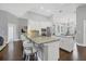 Open kitchen layout with a granite countertops, white cabinetry, and stainless steel appliances at 16621 Berwick Ter, Lakewood Ranch, FL 34202