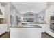 Spacious open kitchen with granite countertops, stainless steel appliances and backyard view at 16621 Berwick Ter, Lakewood Ranch, FL 34202