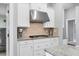 Kitchen features granite countertops, tile backsplash, stainless steel range hood and appliances at 16621 Berwick Ter, Lakewood Ranch, FL 34202