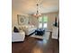 Cozy living room with hardwood floors, natural light, and comfortable seating at 16621 Berwick Ter, Lakewood Ranch, FL 34202