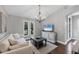 Comfortable living room featuring bright windows, plush seating, and modern decor at 16621 Berwick Ter, Lakewood Ranch, FL 34202