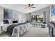 Serene main bedroom boasts a large bed, sitting area, and views of the backyard at 16621 Berwick Ter, Lakewood Ranch, FL 34202