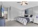 Comfortable main bedroom with an attached vanity area and neutral decor at 16621 Berwick Ter, Lakewood Ranch, FL 34202