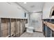 Updated bathroom featuring a white toilet, tile floor, and new glass shower at 2100 Benjamin Franklin Dr # 108, Sarasota, FL 34236