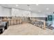 White cabinets, tile backsplash, and island featuring an open layout for easy renovations at 2100 Benjamin Franklin Dr # 108, Sarasota, FL 34236