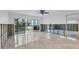 Bright living room boasting tile floors, sliding glass doors, and views of outdoor space at 2100 Benjamin Franklin Dr # 108, Sarasota, FL 34236