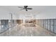 Bright, spacious living room featuring tile flooring and construction elements at 2100 Benjamin Franklin Dr # 108, Sarasota, FL 34236