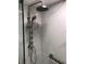 Modern bathroom with a new shower, featuring rainfall shower head and marble tile at 2100 Benjamin Franklin Dr # 108, Sarasota, FL 34236