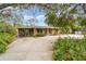 Charming home featuring a spacious driveway and a welcoming screened-in porch at 2885 Arrowhead Rd, Venice, FL 34293
