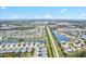 Expansive aerial view of a planned community with homes surrounding picturesque lakes and green spaces at 3922 Wildgrass Pl, Parrish, FL 34219
