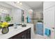 Bright bathroom featuring a white countertop, a walk-in shower, and tile accents at 3922 Wildgrass Pl, Parrish, FL 34219