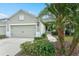 Charming single-story home with a well-manicured lawn, attached garage, and tasteful landscaping at 3922 Wildgrass Pl, Parrish, FL 34219