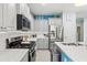 Bright kitchen featuring a gas range, stainless steel appliances, and ample countertop space for cooking at 3922 Wildgrass Pl, Parrish, FL 34219