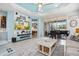 Bright and airy living room with tile flooring, a piano, and a calming coastal color palette at 3922 Wildgrass Pl, Parrish, FL 34219