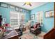 This is a well-lit office with lots of natural light and comfortable seating at 3922 Wildgrass Pl, Parrish, FL 34219